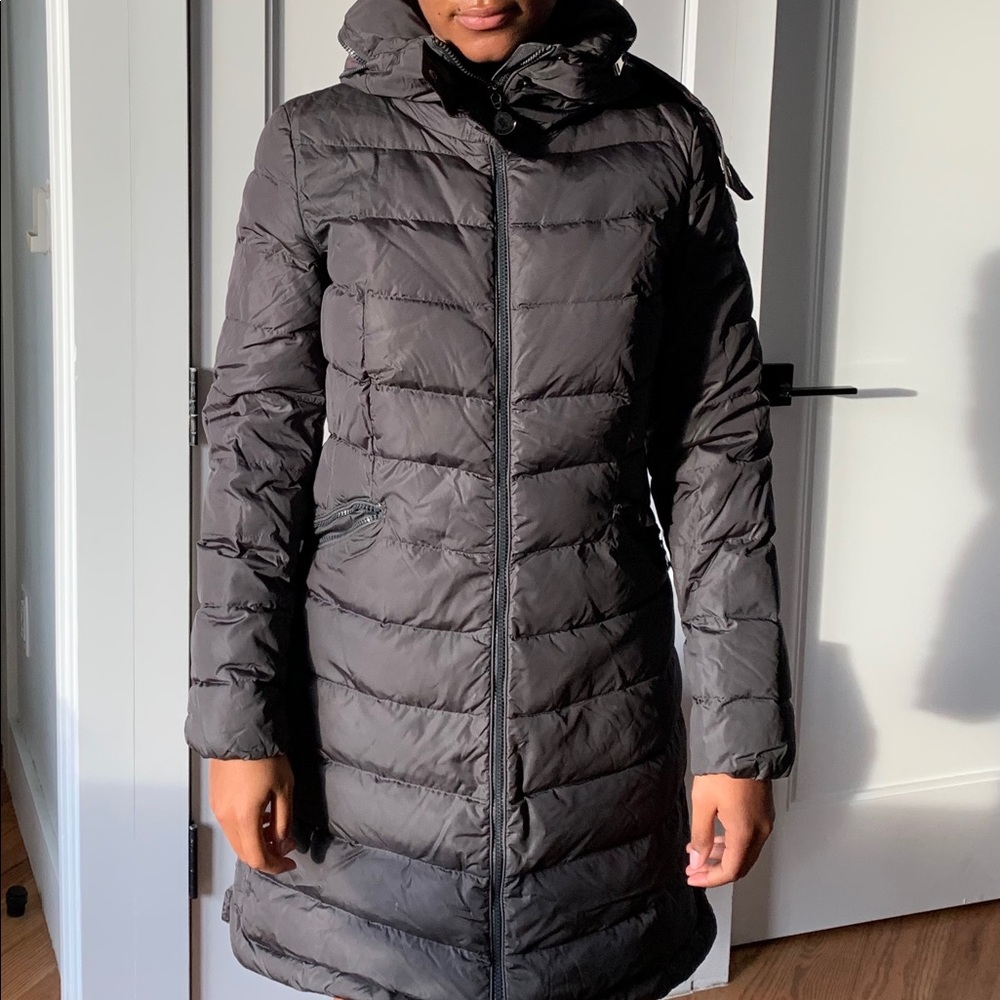 Moncler down grey coat. Great condition but some yellowing of the logos.
